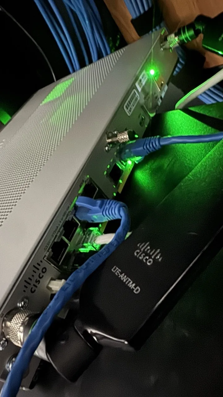 Tangle of cabling at the Cisco switch, unclear which port goes where
